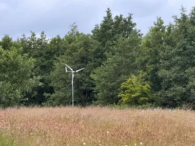 a wind turbine in the middle of a field at Green Oak Nature Retreat in Dunfermline