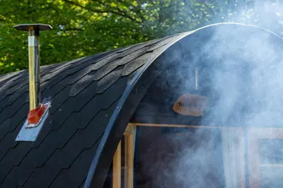 a black roof with smoke coming out of it at Green Oak Nature Retreat in Dunfermline
