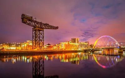 a night view of a city with a crane and a bridge at La Casita, Quarry - 2 bedroom Entire Apartment with Free Parking in Glasgow
