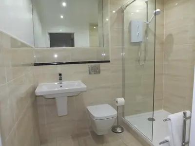 a bathroom with a toilet and a sink and a shower at Lochrin Apartments by Edinburgh City Apartments in Edinburgh