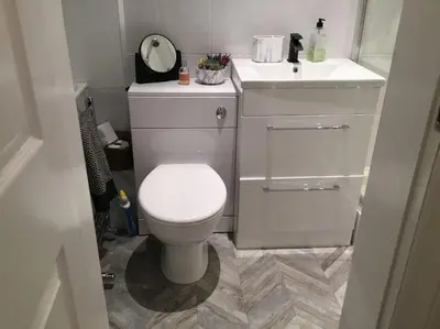 a bathroom with a white toilet and a sink at Beautiful 2 double bedrooms, 2 baths apartment in Port Glasgow