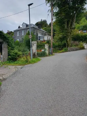 an empty street in front of a house at Little Bay View in Oban