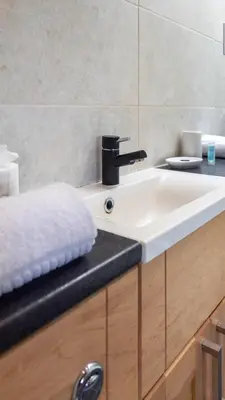 a bathroom with a white sink and a counter at The Hill in Tillicoultry