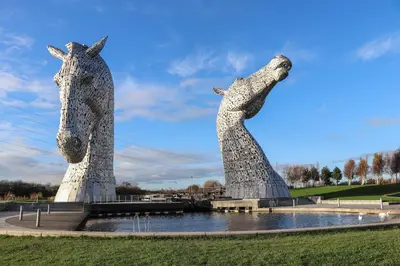 two statues of horses standing next to a body of water at The Barn, Drumbow Farm in Airdrie