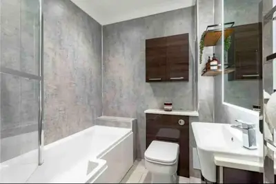 a bathroom with a tub and a toilet and a sink at amazing apartments - Avondale Pl by Stockbridge in Edinburgh