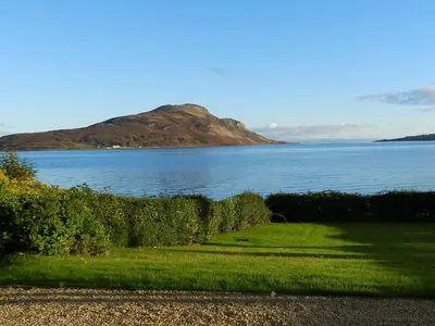 a view of a body of water with a mountain at St Brides in Lamlash