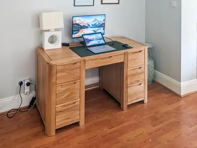 a wooden desk with a laptop computer on it at Brough Hall in Paisley