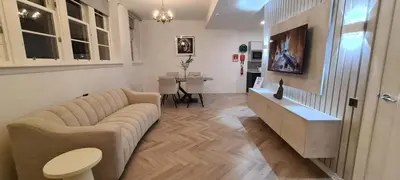 a living room with a couch and a table at The Old Courthouse in Rothesay