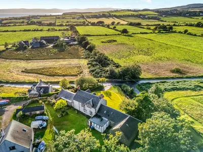 an aerial view of a house in a field at Burncliff in Blackwaterfoot