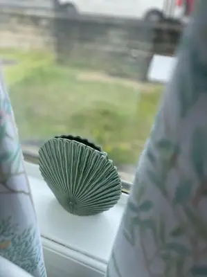 a green and black object sitting on a window sill at 2 Bedrooms Holiday home in Edinburgh near City Center in Edinburgh