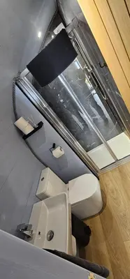 a bathroom with a toilet and a sink at Kintyre Glamping Pods in Campbeltown