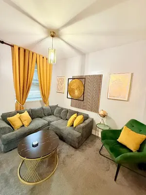 a living room with a couch and a table at Two Bedroom Apartment-Central Edinburgh-Old Town-licensed in Edinburgh