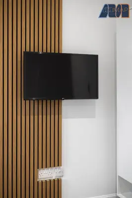 a flat screen tv hanging on a wall at High Street Haven in Kincardine in Kincardine