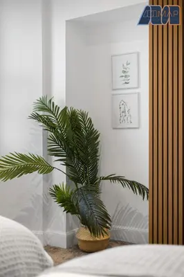 a plant sitting on a table in a bedroom at High Street Haven in Kincardine in Kincardine
