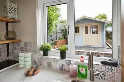 a window in a kitchen with a sink and a window at Modern house near Glasgow 3bdr in Dalmuir