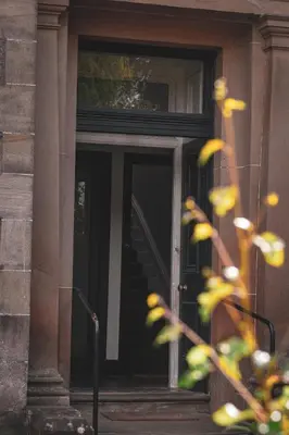 a front door of a building with a staircase at Spacious 4 Bedroom Flat in Stirling in Stirling