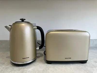 two toasters sitting next to each other on a counter at Elite 3 bedroom family house with free parking in Newton Mearns