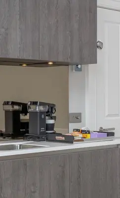a kitchen with a counter top with a coffee maker at Flat with Majestic views in West End Wonderland in Edinburgh