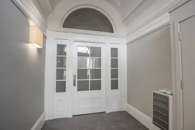a room with a white door and a window at Flat with Majestic views in West End Wonderland in Edinburgh