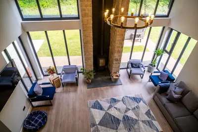 an overhead view of a living room with chairs and a chandelier at Lowwood Lodges in Houston