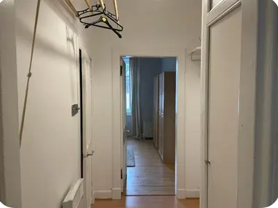 a hallway with a hallway leading into a room at Homely in Hampden in Glasgow
