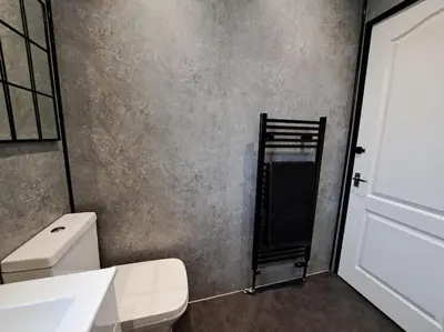 a bathroom with a white toilet and a sink at Glasgow Apartment close to the airport in Renfrew