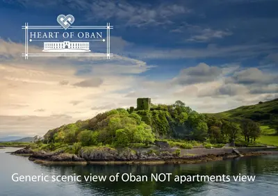 a castle on a small island in the water at Heart of Oban in Oban