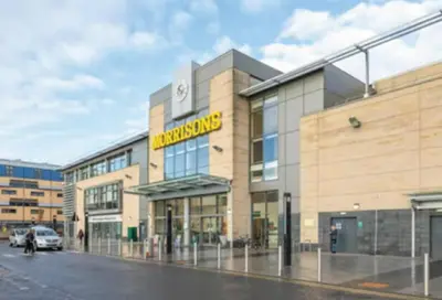 a building with a car parked in front of it at Comfortable Double Room, Great Transport to City Centre and Airport, 5 mins to Beach, Great Value in Edinburgh
