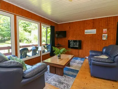 a living room with two couches and a coffee table at Lodge 1 