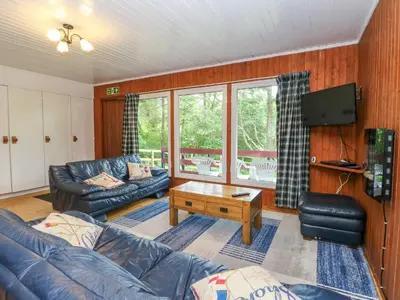 a living room with a couch and a table at Lodge 6 - 