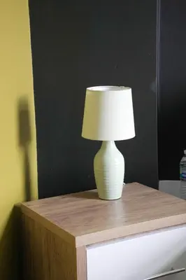 a white lamp sitting on top of a table at Andrew House in Bathgate