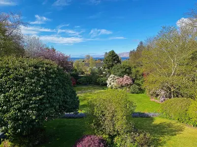 an overhead view of a garden with trees and bushes at The Garden Flat in Fort William