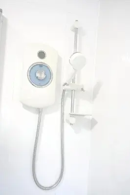 a shower with a shower head in a bathroom at Rhyber Avenue in Lanark