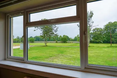 a window with a view of a park at Powfoulis Inn in Falkirk