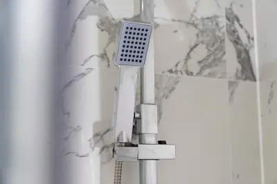a toothbrush sitting on top of a bathroom sink at The Manor - Beachwalk Apartments in Ayr
