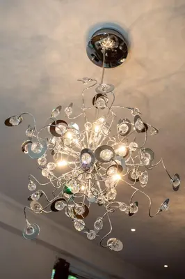 a chandelier is hanging from a ceiling at The Banking Hall in Polmont