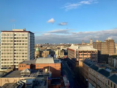 a view of a city with tall buildings at Duplex Apartment in Glasgow