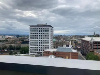 a view of a city with a tall white building at Duplex Apartment in Glasgow