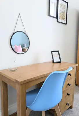 a desk with a blue chair and a mirror at Campbeltown Retreat in Campbeltown