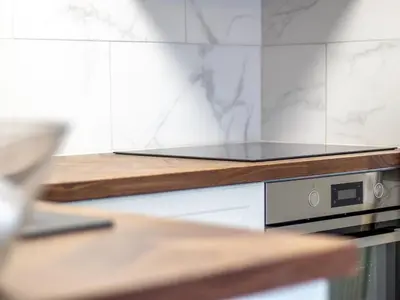a kitchen with a stove top oven on a counter at Studio Dream with Loft West End - Pass the Keys in Glasgow