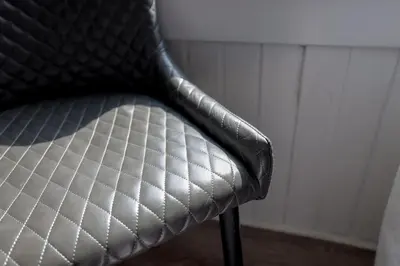 a close up of a black chair in a room at Three Oban in Oban