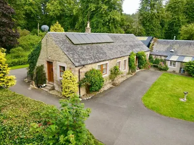 an aerial view of a house with a solar roof at Country Cottage on Private Estate in Minishant