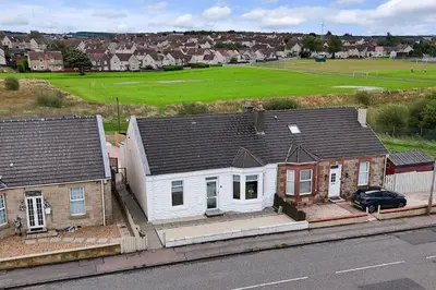 an aerial view of a house with a soccer field at Diamond House - 4 bedroom luxury home in Airdrie