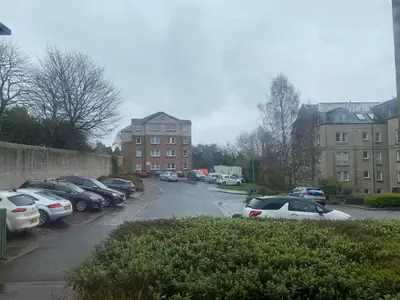 a bunch of cars parked in a parking lot at Prime City Centre - Ground Floor Parking by TBA in Dunfermline