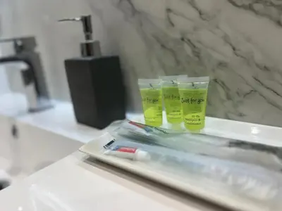 two cups sitting on a counter in a bathroom at 3 Bed - Sleeps 7 - Free Parking - Central Location in Glasgow