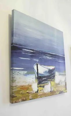 a painting of a boat on the beach at Blackness Apartment in Linlithgow