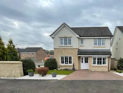 a house with a brick driveway in front of it at Entire 4 bed perfect family home in Glasgow in Nitshill