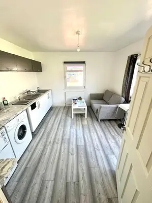 a living room with a couch and a table at Entire Private 1 Bedroom - Guest Suite in Glasgow in Glasgow