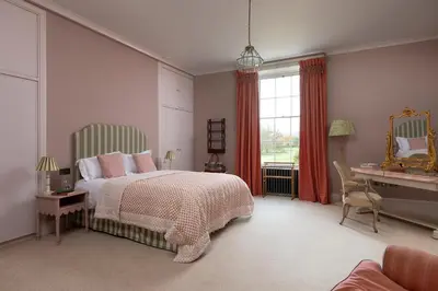 a bedroom with a bed and a desk and a window at Dabton House in Carronbridge