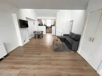 a living room with a couch and a table at Edinburgh elms for 4 - New Town - City Center EB8 in Edinburgh
